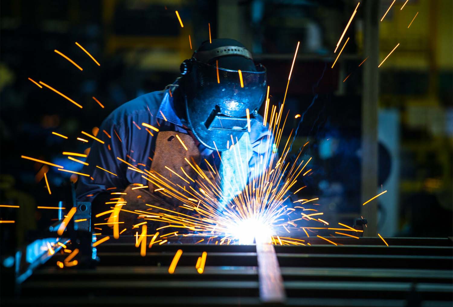 Welder DION fabricating metal components during the manufacturing stage