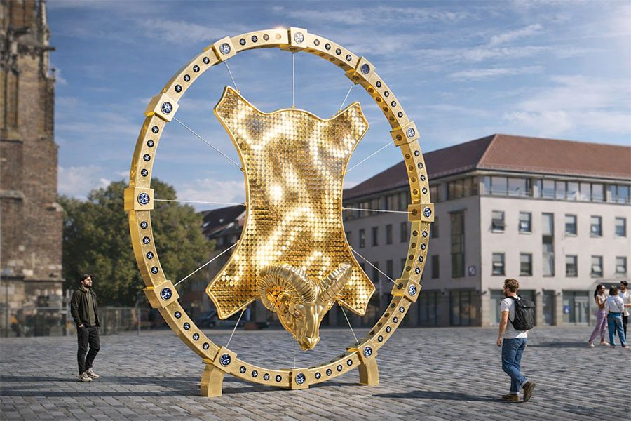 Golden ram head sculpture with reflective mosaic panel